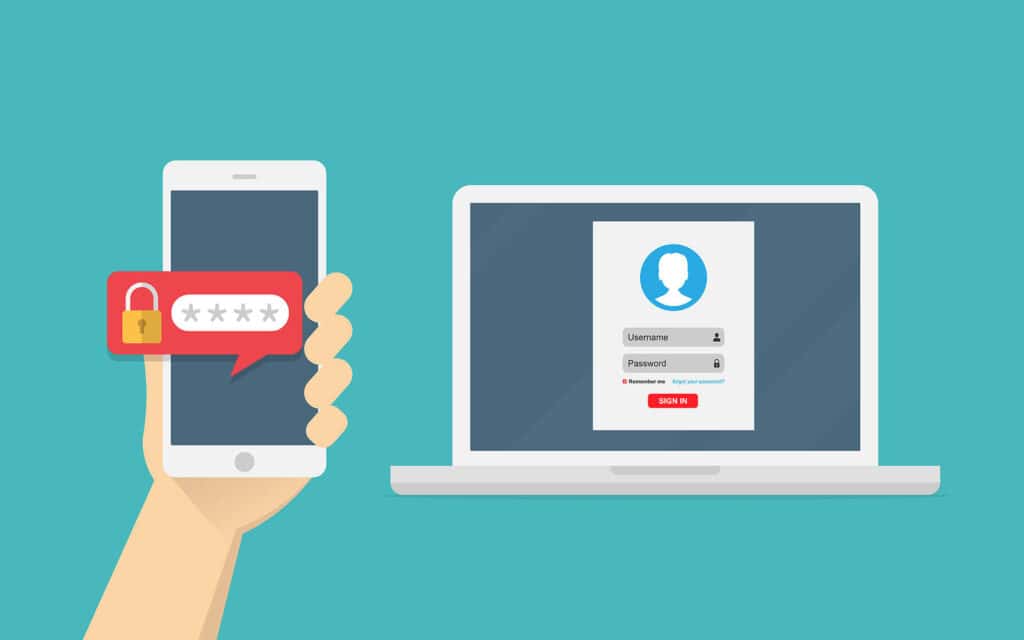 MFA code on phone screen next to laptop